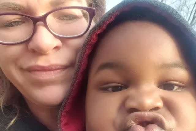 <p>GoFundMe</p> A photo of Melissa Robertson and one of her sons.