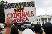 <p>A woman holds up a sign in support of the Obama administration program known as Deferred Action for Childhood Arrivals, or DACA, during an immigration reform rally at the White House in Washington on Aug. 15, 2017. After months of delays, President Donald Trump is expected to decide soon on the fate of so -alled DREAMers who were brought into the country illegally as children as he faces a looming court deadline and is digging in on appeals to his base. (Photo: Jacquelyn Martin/AP) </p>