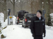 Black taxi minivans enter the Finnish government's Koenigstedt Manor in Vantaa, Finland, March 20, 2018. Lehtikuva/Vesa Moilanen via REUTERS