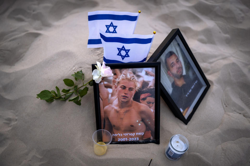 FILE - A photo of Keshet Casarotti, 21, who was killed in Hamas' militants rampage through Nova Music Festival in southern Israel on Oct. 7, is displayed at a vigil on the beach honoring the victims in Tel Aviv, Israel, Saturday, Nov. 11, 2023. Israel and Hamas have been at war for 100 days. The war already is the longest and deadliest between Israel and the Palestinians since Israel’s establishment in 1948, and the fighting shows no signs of ending.(AP Photo/Oded Balilty, File)