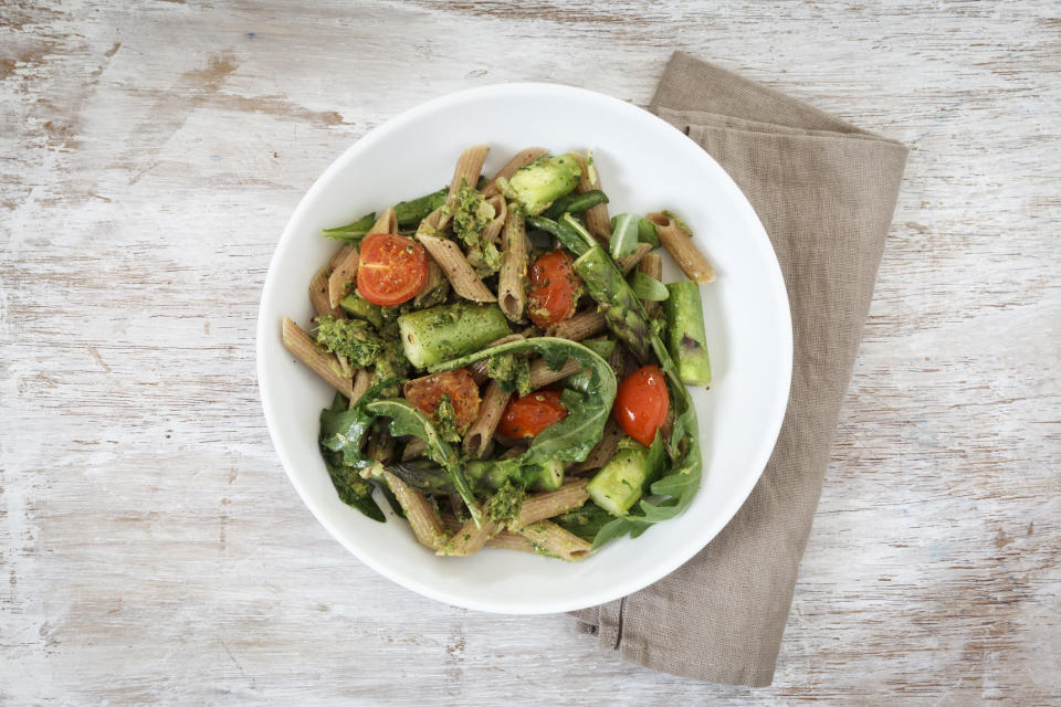 Pasta with lots of vegetables in a bowl.