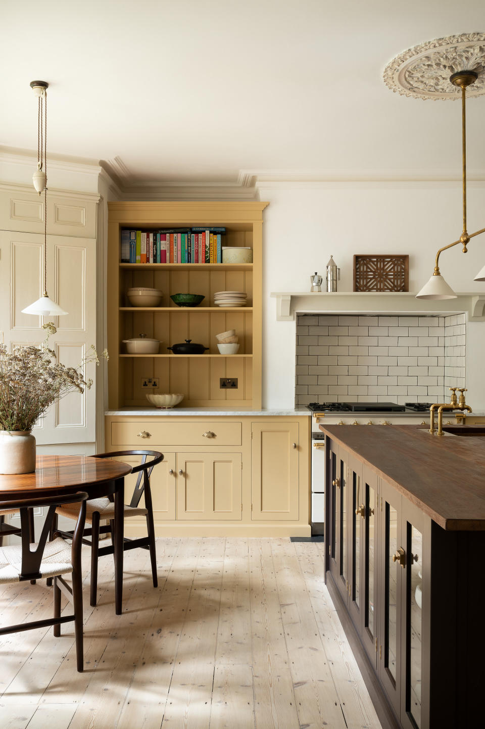 Yellow and purple kitchen by deVOL