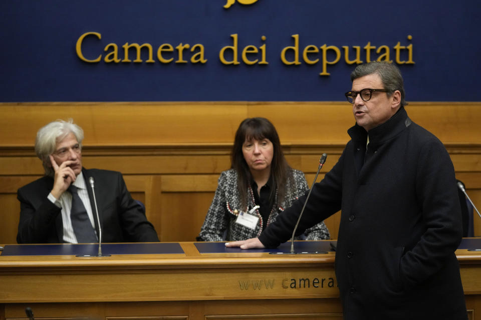 Senator Carlo Calenda, right, answers reporters' questions during a press conference on the establishing of a parliamentary investigative commission on Emanuela Orlandi, a 15-year-old daughter of a Vatican employee disappeared in 1983, and other cold cases in Rome, Tuesday, Dec. 20, 2022. At left, Pietro Orlandi, brother of Emanuela Orlandi, and at center is Maria Antonietta Gregori, sister of Mirella another 15-year old girl disappeared in 1983. (AP Photo/Alessandra Tarantino)