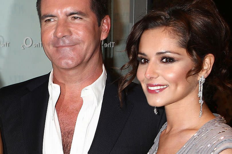 Simon Cowell and Cheryl Cole arrive at the National Television Awards held the at The O2 Arena on January 20, 2010 in London, England.