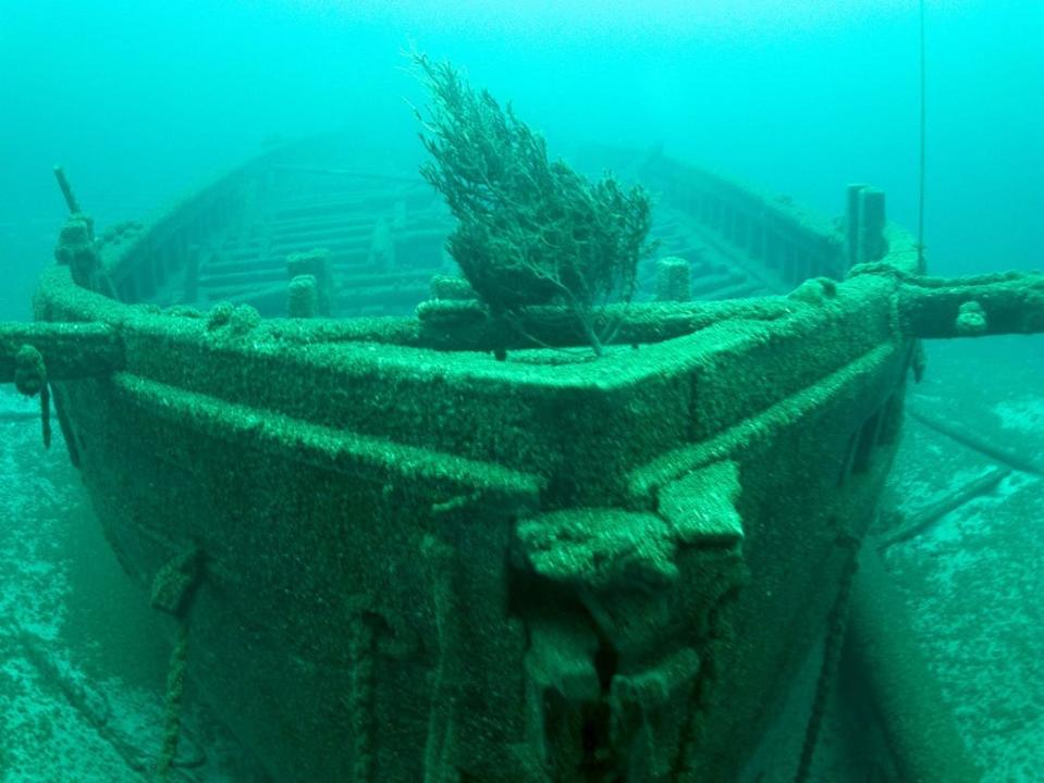 The bow of the Rouse Simmons shipwreck with a Christmas tree placed on its deck.