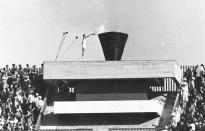 FILE - In this Oct. 10, 1964 file photo, Japanese runner Yoshinori Sakai lights the Olympic cauldron during the opening ceremony of the 1964 Summer Olympics in Tokyo. Every Japanese of a certain age has memories of the 1964 Tokyo Olympics. Even younger Japanese have connections through parents or aunts and uncles who saved old photos, faded certificates, or recall getting a television for the first time to watch the Games. (AP Photo, File)