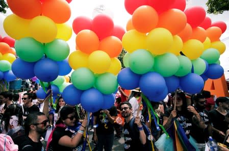 People take part in the annual Gay Pride parade along the Central Avenue, in San Jose