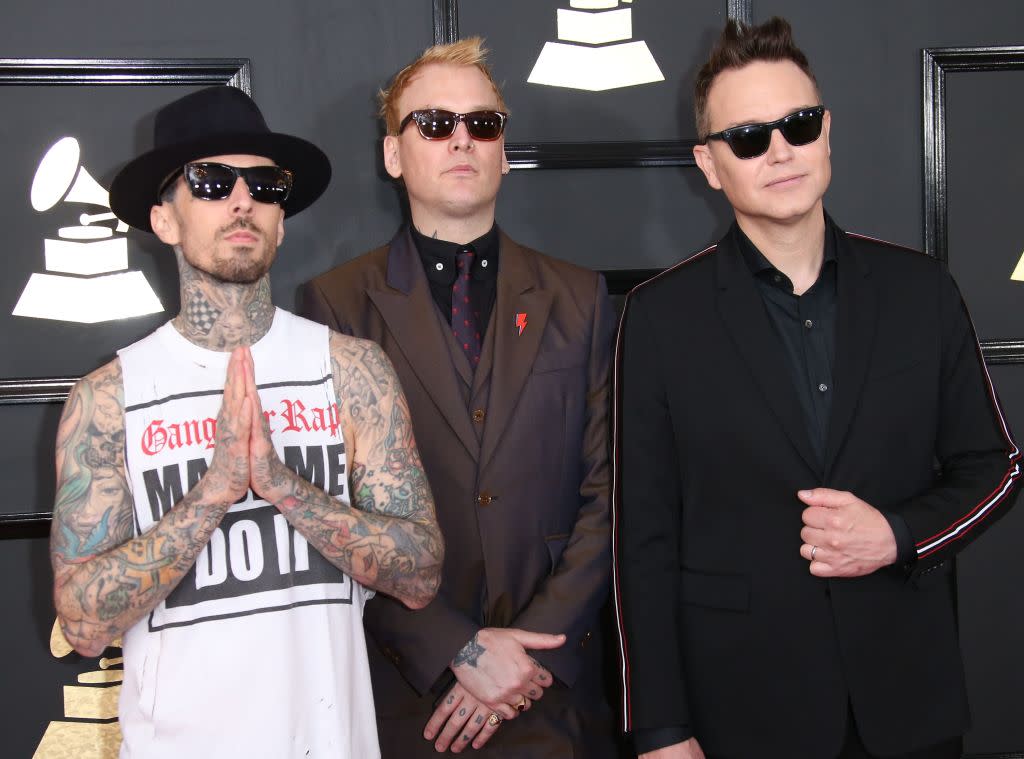 Travis Barker, left, attend the 2017 Grammy Awards with bandmates Matt Skiba and Mark Hoppus. (Photo: Dan MacMedan/WireImage)