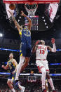 Indiana Pacers forward Obi Toppin, left, rebounds a ball against Chicago Bulls forward Torrey Craig during the first half of an NBA basketball game in Chicago, Wednesday, March 27, 2024. (AP Photo/Nam Y. Huh)