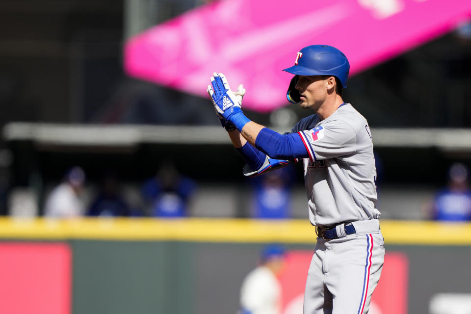 Texas Rangers' Evan Carter reacts after hitting a double against the Seattle Mariners during the third inning of a baseball game Sunday, Oct. 1, 2023, in Seattle. (AP Photo/Lindsey Wasson)