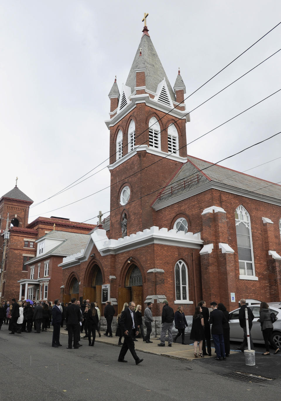 Friends and family attend a funeral mass for eight of the 20 people killed in last Saturday's fatal limousine crash in Schoharie, N.Y., during a memorial service at St. Stanislaus Roman Catholic Church in Amsterdam, N.Y., Saturday, Oct. 13, 2018. (AP Photo/Hans Pennink)