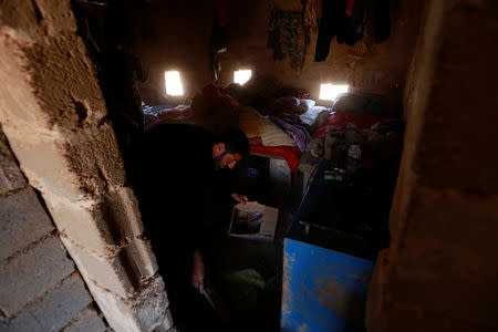 Popular Mobilisation Forces (PMF) fighters rest near the Iraqi-Syrian border in al-Qaim, Iraq, November 26, 2018. REUTERS/Alaa al-Marjani