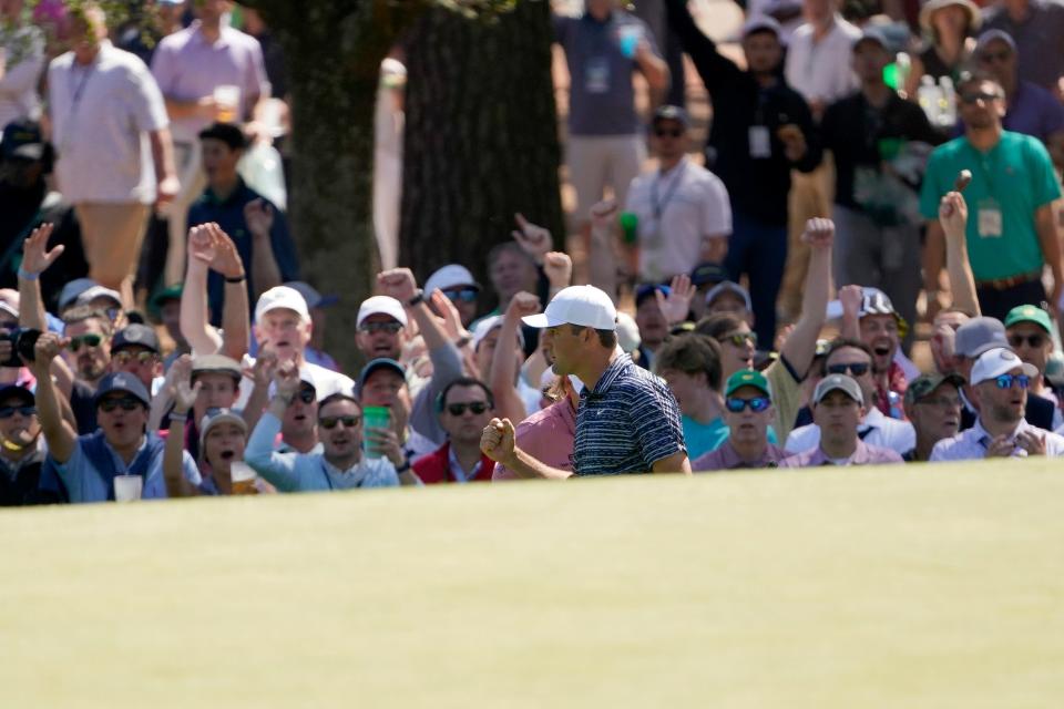 Scottie Scheffler pumps his fist after pitching in for birdie on No. 3 during the final round of the Masters Tournament. With his birdie and Cam Smith's bogey on the hole, his three-shot lead was never challenged the rest of the day. Andrew Davis Tucker-Augusta Chronicle/USA TODAY Sports