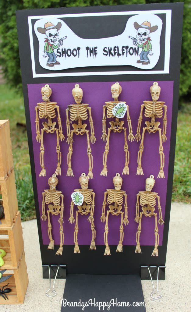 <p>What kid wouldn't want to shoot slime at a skeleton?</p><p><strong>Get the tutorial at <a href="http://brandyshappyhome.com/dolloween-carnival-part-2-carnival-games/" rel="nofollow noopener" target="_blank" data-ylk="slk:Brandy's Happy Home;elm:context_link;itc:0;sec:content-canvas" class="link ">Brandy's Happy Home</a>.</strong></p><p><strong><a class="link " href="https://www.amazon.com/Outus-Halloween-Skeleton-Plastic-Decoration/dp/B07TZHNDY2/ref=sr_1_6?dchild=1&keywords=skeleton+small&qid=1626721737&sr=8-6&tag=syn-yahoo-20&ascsubtag=%5Bartid%7C10050.g.3476%5Bsrc%7Cyahoo-us" rel="nofollow noopener" target="_blank" data-ylk="slk:SHOP SKELETONS;elm:context_link;itc:0;sec:content-canvas">SHOP SKELETONS</a><br></strong></p>