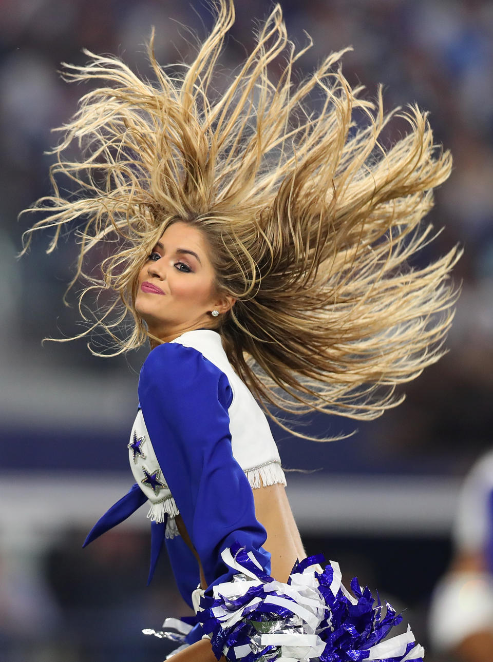<p>A Dallas Cowboys Cheerleader performs during a game against the New York Giants at AT&T Stadium on September 10, 2017 in Arlington, Texas. (Photo by Tom Pennington/Getty Images) </p>