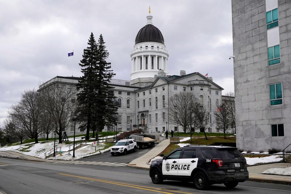 Capitol Police and Augusta Police patrol the Statehouse grounds, Sunday, Jan. 17, 2021, in Augusta, Maine. Law enforcement is taking precautions for possible demonstrations in the wake of the recent breach of the U.S. Capitol.