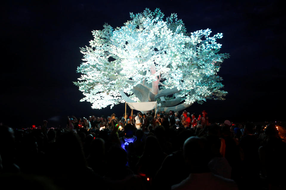 <p>A couple is married under the Tree of TÃnÃrÃ art installation as approximately 70,000 people from all over the world gathered for the annual Burning Man arts and music festival in the Black Rock Desert of Nevada, Aug. 29, 2017. (Photo: Jim Urquhart/Reuters) </p>