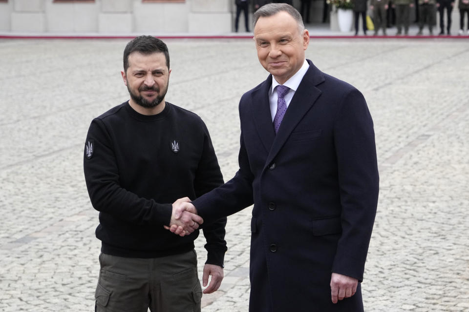 Poland's President Andrzej Duda, right, welcomes Ukrainian President Volodymyr Zelenskyy as they meet at the Presidential Palace in Warsaw, Poland, Wednesday, April 5, 2023. (AP Photo/Czarek Sokolowski)