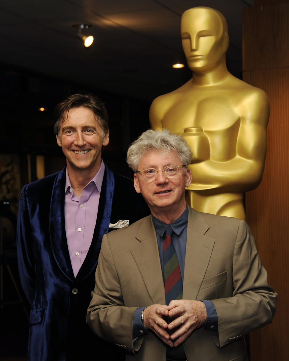 Nicholas Reed, left, and Malcolm Clarke, co-filmmakers of the Oscar-nominated documentary short film "The Lady in Number 6: Music Saved My Life," pose together at a reception featuring the Oscar nominees in the Documentary Feature and Documentary Short Subject categories on Wednesday, Feb. 26, 2014, in Beverly Hills, Calif. The Oscars will be held on Sunday at the Dolby Theatre in Los Angeles. (Photo by Chris Pizzello/Invision/AP)