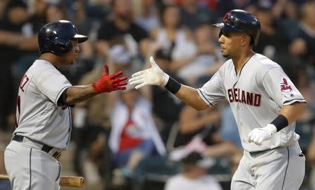 Aug 11, 2018; Chicago, IL, USA; Cleveland Indians left fielder Michael Brantley (23) celebrates his home run against the Chicago White Sox with Cleveland Indians third baseman Jose Ramirez (11) during the sixth inning at Guaranteed Rate Field. Mandatory Credit: Jim Young-USA TODAY Sports