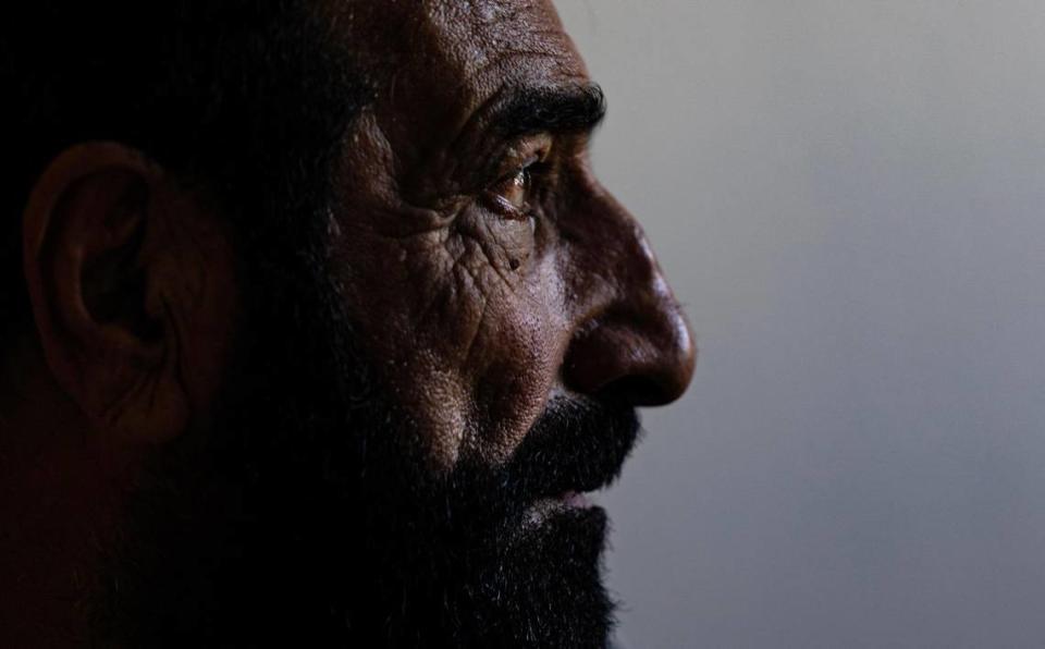 Mohammad Amini, an Afghan refugee who fled Afghanistan following the Taliban takeover, in his apartment living room in Fort Worth on Sept. 27, 2023. Amini was part of the armed forces helping Americans when he lived in Afghanistan. His work made him a target for the Taliban, which led to him and his family fleeing the country.