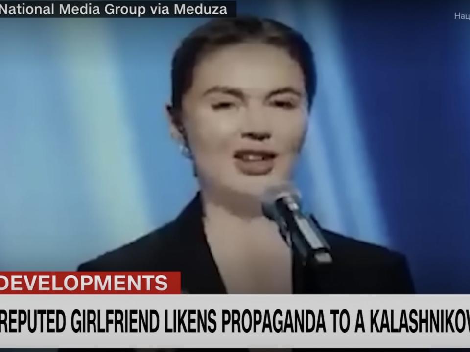 A screenshot from CNN coverage of a speech by Alina Kabaeva in early February 2023. Kabaeva talks in front of a blue background. The chyron reads: "Putin's reputed girlfriens likens propaganda to a Kalashnnnikov."