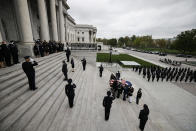 An honor guard carries the flag-draped casket of slain U.S. Capitol Police officer William “Billy” Evans up the Capitol steps to the Capitol rotunda where he will lie in honor Tuesday, April 13, 2021 in Washington. (Carlos Barria/Pool via AP)