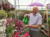 <p>Owner of Hillmount Garden Centre Robin Mercer watering flowers, as a hosepipe ban in Northern Ireland has prompted an unprecedented rush on another gardener’s friend, the watering can. Cans of all shapes and sizes have been flying off the shelves across the region as gardeners turn to more labour-intensive means to keep their plants and lawns hydrated. (Picture: PA) </p>