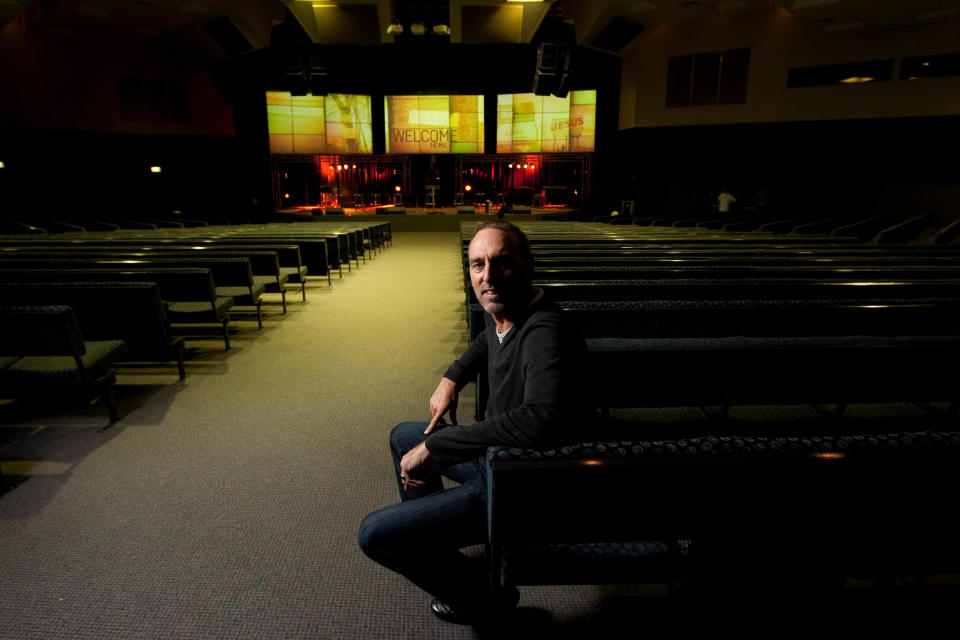 Brian Houston sitting in an auditorium at Hillsong Church