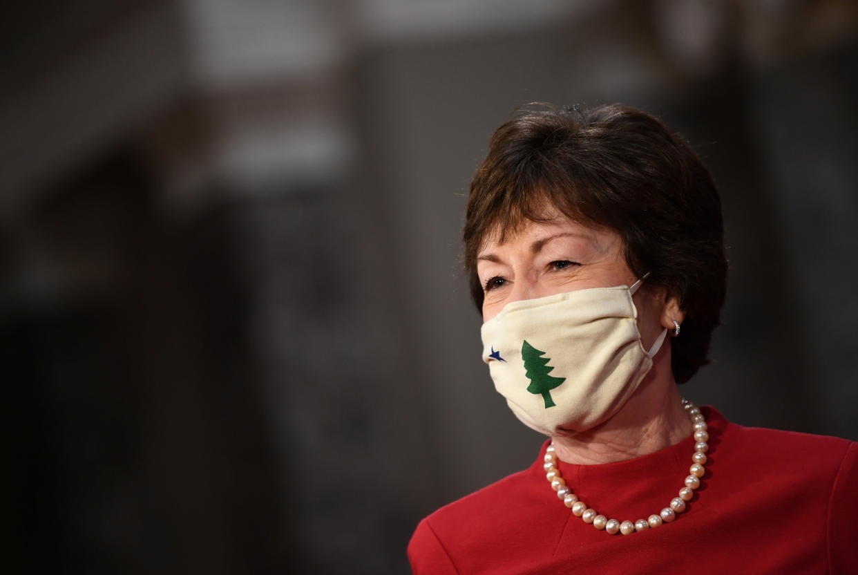 Senator Susan Collins (R-ME) wears a face mask as she participates in a swearing-in for the 117th Congress with Vice President Mike Pence, in the Old Senate Chambers at the U.S. Capitol Building in Washington, DC, U.S.  January 3, 2021. Kevin Dietsch/Pool via REUTERS
