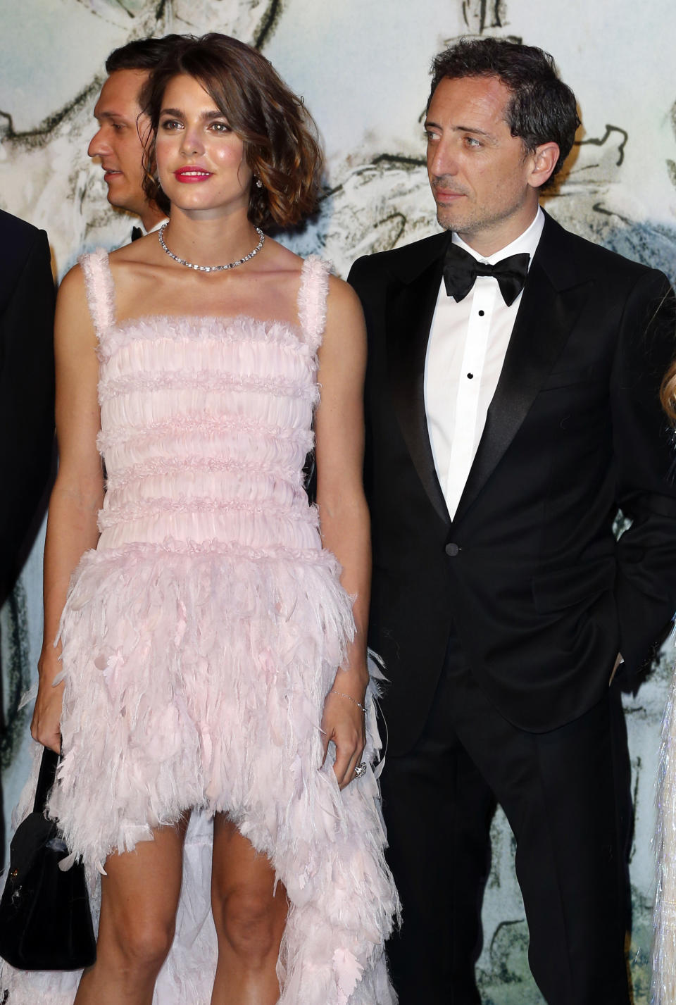 Charlotte Casiraghi and French humorist Gad Elmaleh poses prior to the annual Rose Ball at the Monte-Carlo Sporting Club in Monaco, on March 23, 2013. The Rose Ball is one of the major charity events in Monaco. Created in 1954, it benefits the Princess Grace Foundation. Directed by German Couturier Karl Lagerfeld, this year's event named 