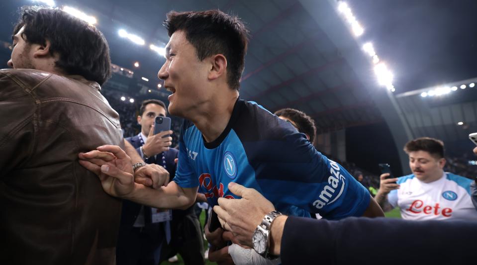 Kim Min-jae of Napoli celebrates with fans on the pitch at full-time of the Serie A match between Udinese and Napoli at the Dacia Arena on May 4 in Udine, Italy.