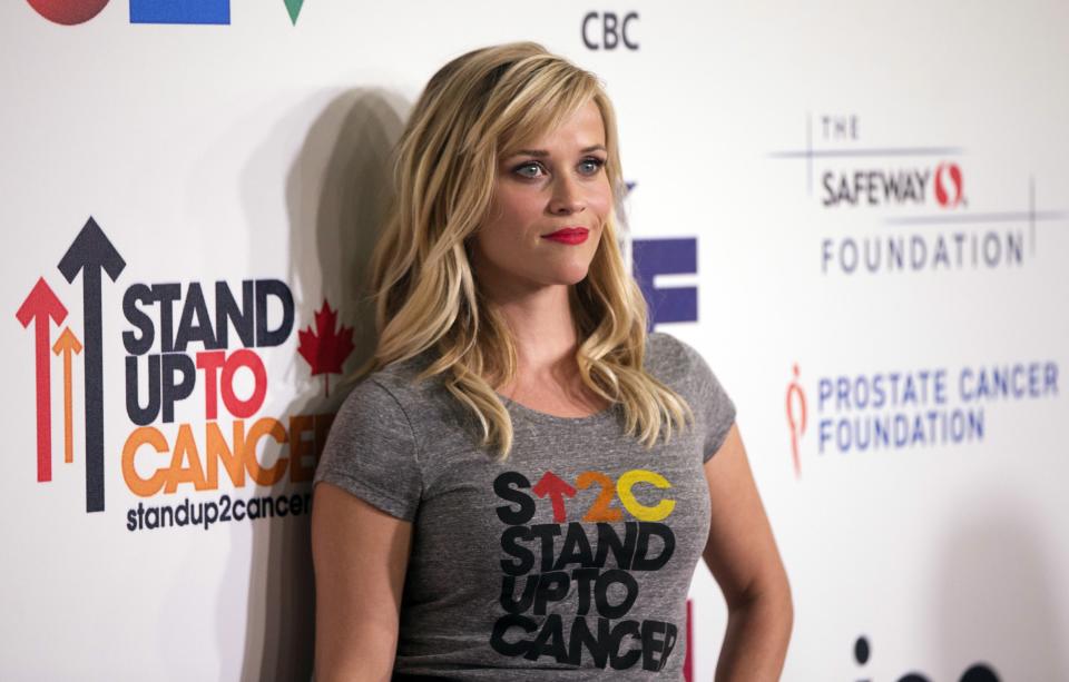 Actress Reese Witherspoon poses as she arrives for the fourth biennial Stand Up To Cancer fundraising telecast in Hollywood, California September 5, 2014. REUTERS/Mario Anzuoni (UNITED STATES - Tags: ENTERTAINMENT HEALTH)