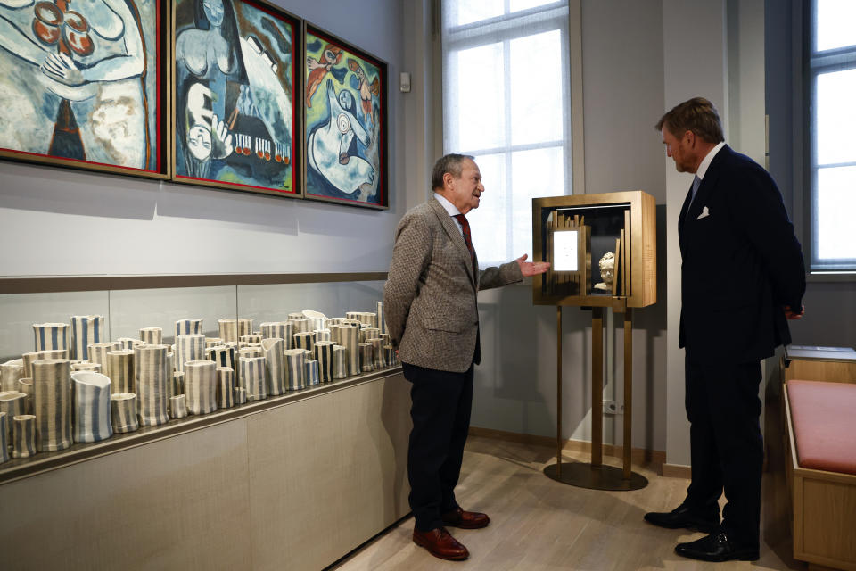 Netherlands' King Willem Alexander, right, tours the National Holocaust Museum in Amsterdam, Netherlands, Sunday, March 10, 2024. The Netherlands National Holocaust Museum is opening on Sunday in a ceremony presided over by the Dutch king as well as Israeli President Isaac Herzog, whose presence is prompting protest because of Israel's deadly offensive against Palestinians in Gaza. (Piroschka van de Wouw/Pool Photo via AP)