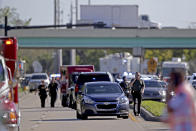 <p>Police and fire rescue vehicles converge on Stoneman Douglas High School following a shooting at Marjory Stoneman Douglas High School in Parkland, Fla., on Feb. 14, 2018. (Photo: John McCall/South Florida Sun-Sentinel via AP) </p>