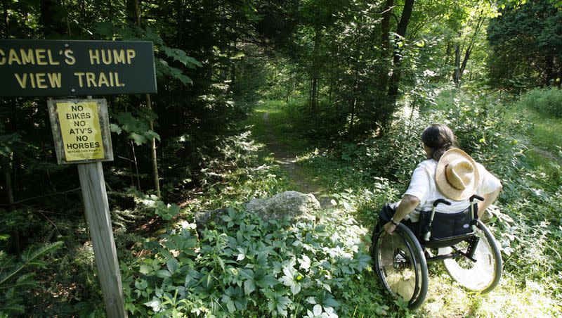 Deborah Lisi-Baker starts her wheelchair up the View Trail at Camel’s Hump in Duxbury, Vt., Thursday, July 26, 2007.