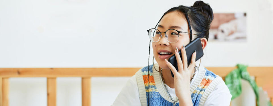 Teenage girl talking on phone