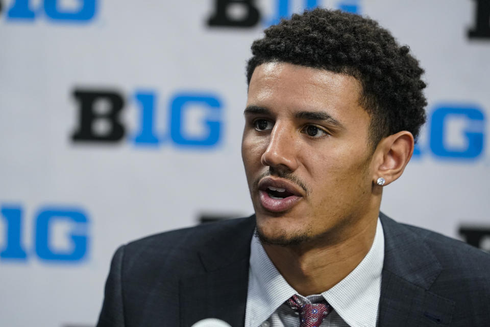 Wisconsin's Jonathan Davis speaks during the Big Ten NCAA college basketball media days in Indianapolis, Friday, Oct. 8, 2021. (AP Photo/Michael Conroy)