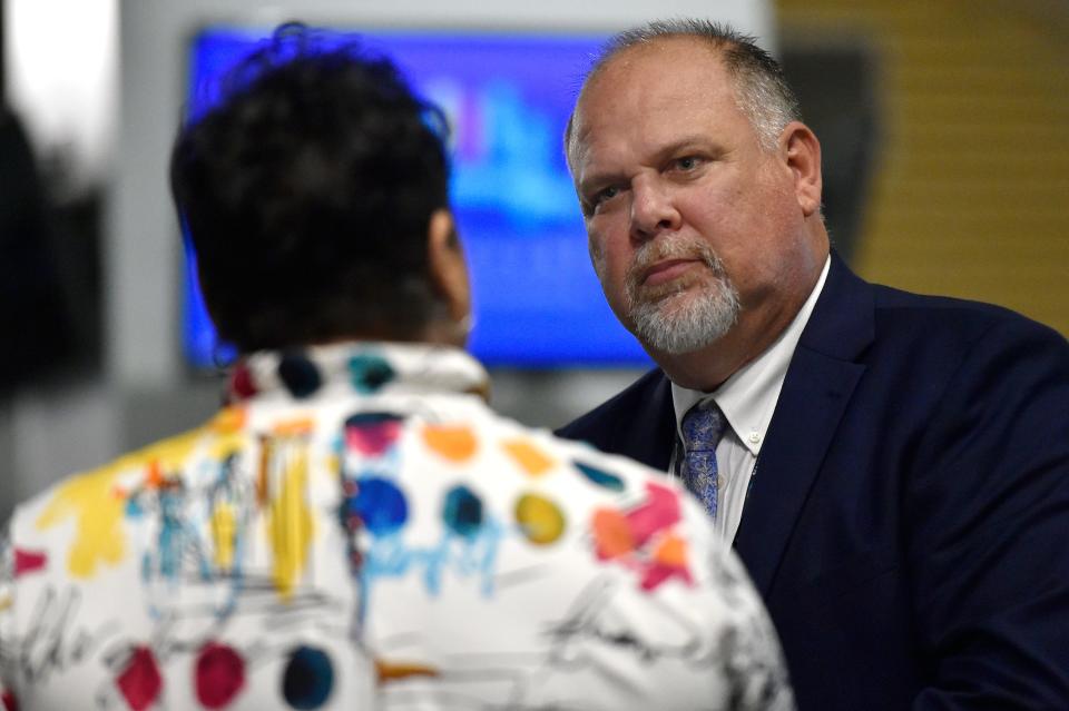 Christopher Berniue talks with Latrese Fann, the regional superintendent over 28 challenge elementary schools in Duval County, during a meet-and-greet event fr superintendent finalists at EverBank Stadium last week.