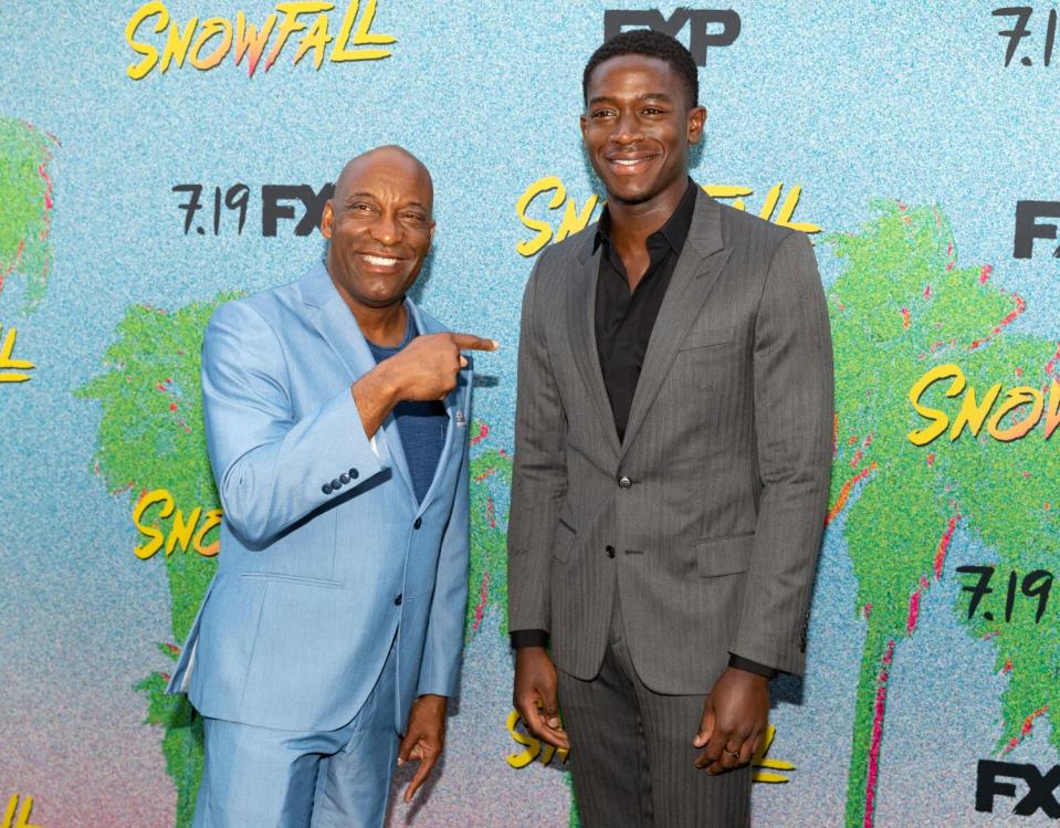 Actors John Singleton and Damson Idris on the red carpet