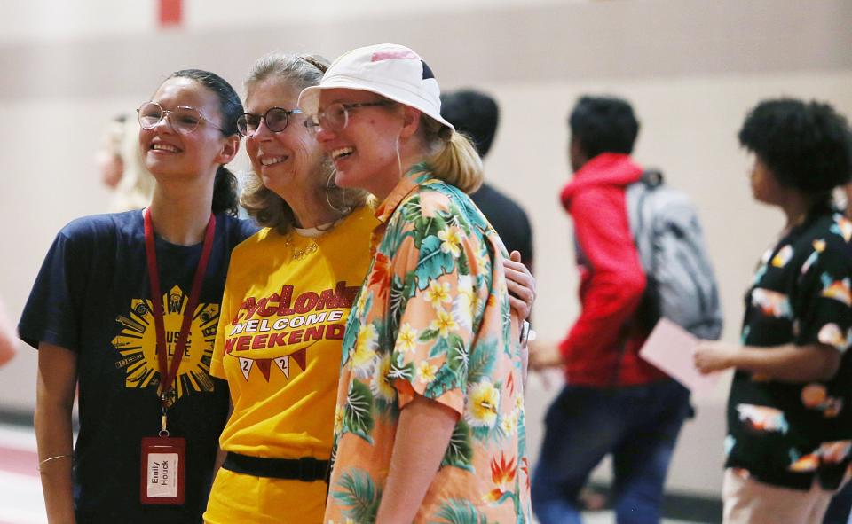 Iowa State University president Wendy Wintersteen poses with juniors Emily Houck (left) and April Wigdahl while welcoming students in a cookout of the university's welcome weekend at Lied Athletic Recreation Center on Friday, Aug. 18, 2023, in Ames, Iowa.