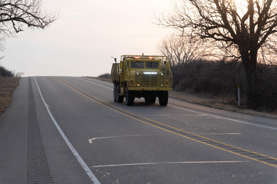 An emergency vehicle travels down Highway 60 near Miami to combat the Smokehouse Creek Fire in Roberts County.