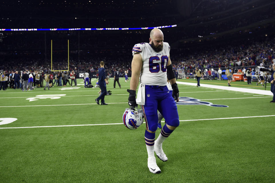 Buffalo Bills center Mitch Morse (60) walks off the field after an NFL wild-card playoff football game against the Houston Texans Saturday, Jan. 4, 2020, in Houston. The Texans won 22-19 in overtime.(AP Photo/Eric Christian Smith)
