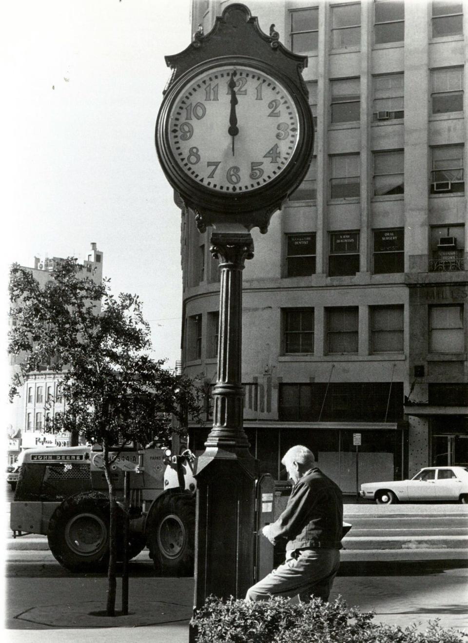 Edgar Bush is shown Oct. 28, 1973, making final adjustments after repairs to the clock that had been returned to San Jacinto Plaza.