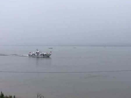 A rescue boat is seen at the site after a ship sank at the Jianli section of Yangtze River, Hubei province, China, June 2, 2015. REUTERS/Stringer