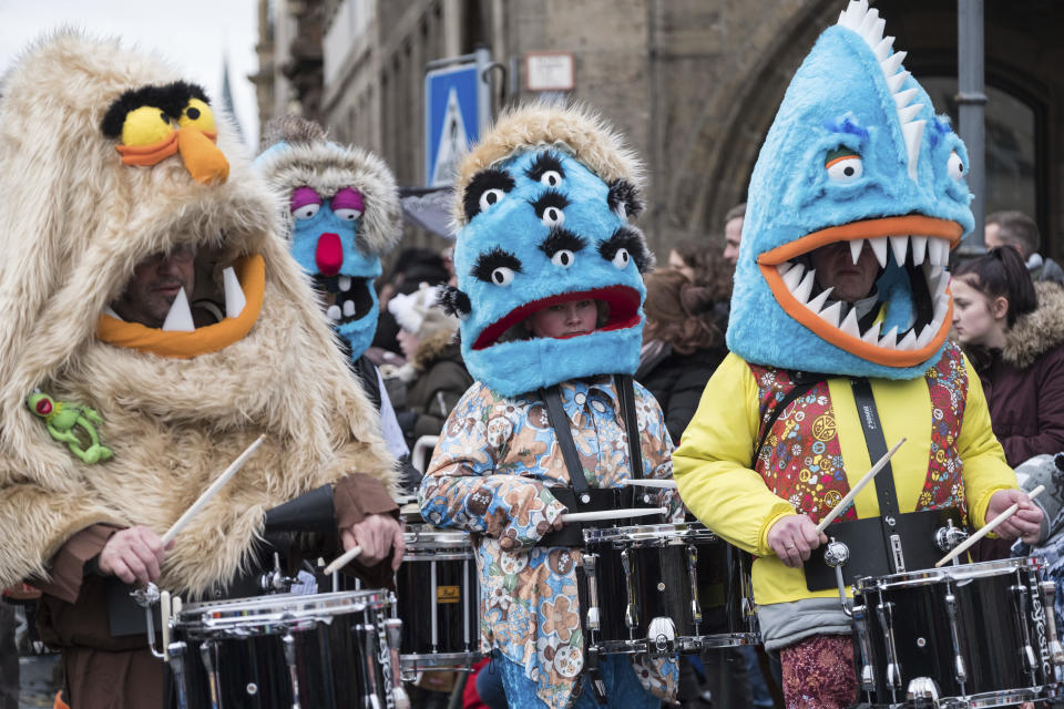 <p>A costumed brass band takes part in a carnival parade in Braunschweig, Germany, Feb. 11, 2018. (Peter Steffen/dpa via AP) </p>