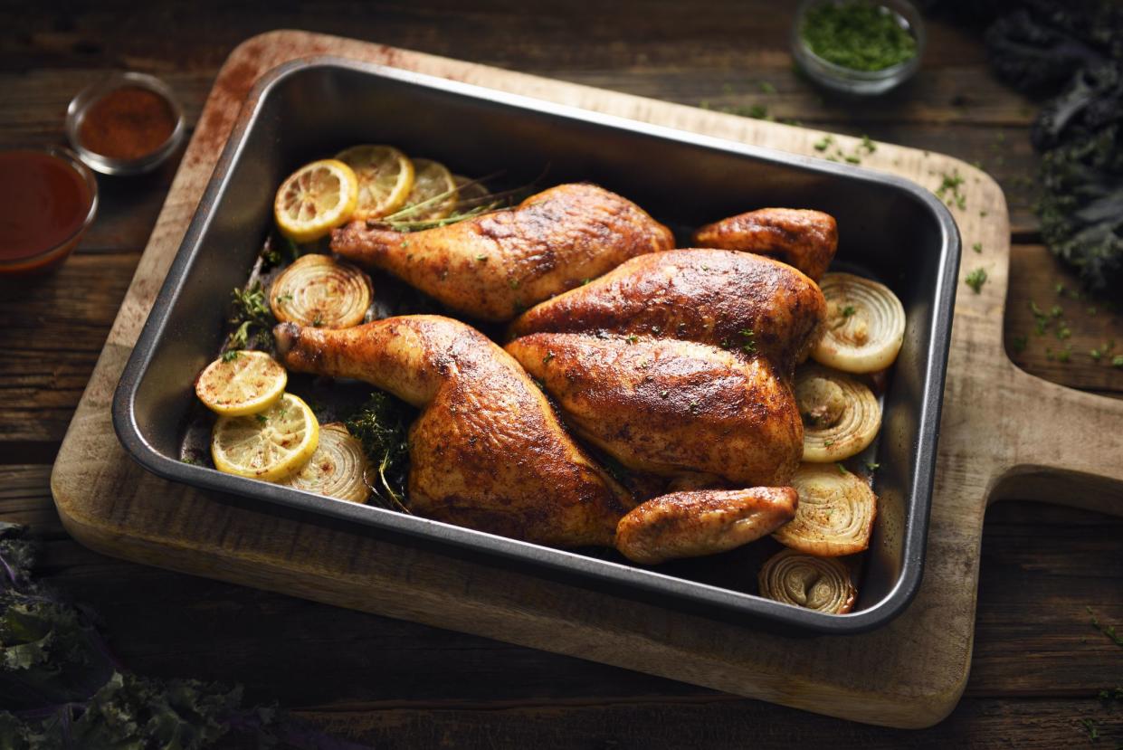 Portuguese butterflied roast chicken in a cooking pan, crapaudine style