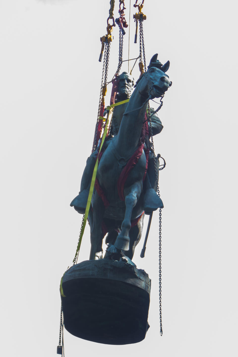 The statue of Stonewall Jackson is carried by crane from its pedestal on Saturday, July 10, 2021 in Charlottesville, Va. The removal of the Lee and Jackson statues comes nearly four years after violence erupted at the infamous “Unite the Right” rally. (AP Photo/John C. Clark)