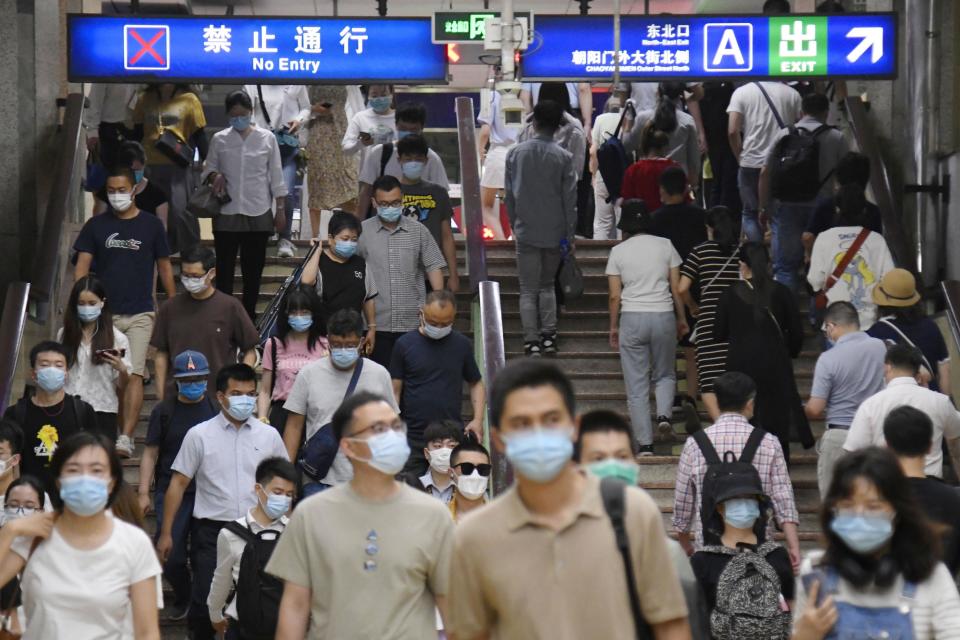 Commuters head to work in Beijing on June 17, amid concern over a possible resurgence in coronavirus infections in the capital. Source: AAP