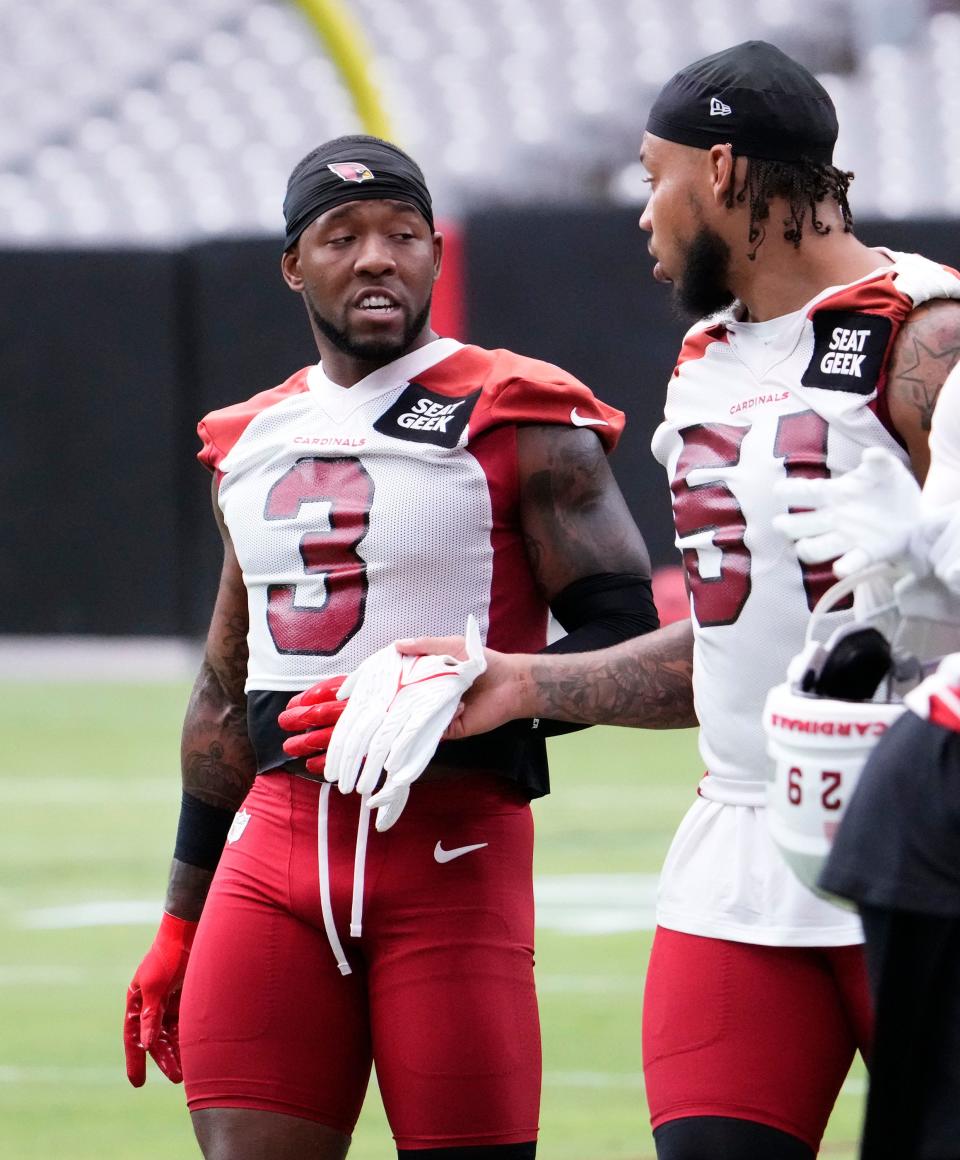 Jul 26, 2023; Glendale, AZ, USA; Arizona Cardinals safety Budda Baker (3) talks to linebacker Josh Woods (51) during training camp at State Farm Stadium. Mandatory Credit: Rob Schumacher-Arizona Republic